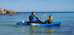 Feelfree Juntos paddling with a child up front 