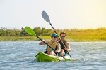 Paddling the Feelfree Gemini Sport along a river