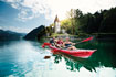 Family enjoying a river paddle on the Gumotex Seawave inflatable kayak