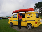 loading the perception triumph 13 on to a roof rack