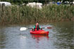 Paddling along in the Perception Sundance open cockpit kayak