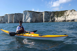 Connor from Southampton Canoes kayaking at Old Harry