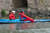 Kayakers getting ready to paddle while wearing the Palm Bora drysuit