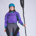 A female paddler wearing the Purple Palm Riff 2.0 PFD