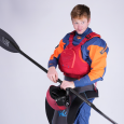 A male paddler wearing the Palm Riff 2.0 in the Samba colour