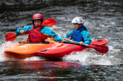 Kids having fun on the river, wearing the Palm Rocket Drysuit