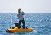reeling in a catch on the Hobie Pro Angler 12