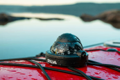 The Silva 58 Compass clipped to the decklines on a kayak