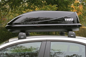 Thule Ocean 100 Roof Box Mounted To A vehicles Roof Rack