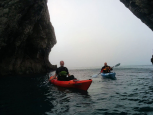 Kayaking through Durdle Door on a Perception Triumph 13 Comfort